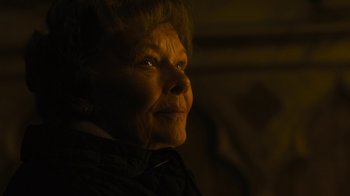 Movie still from “Philomena” (2013), directed by Stephen Frears – An older woman is looking into the light; Close Up shot, Low angle