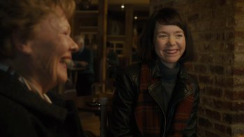 Movie still from “Philomena” (2013), directed by Stephen Frears – Two women sitting at a table talking to each other; Medium shot, Over the shoulder angle