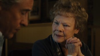 Movie still from “Philomena” (2013), directed by Stephen Frears – An older woman is looking into the distance; Close Up shot, Over the shoulder angle