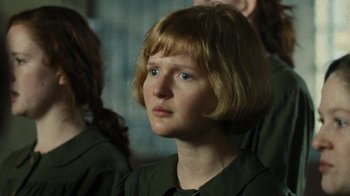 Movie still from “Philomena” (2013), directed by Stephen Frears – A woman with blonde hair and blue eyes looking to her left; Close Up shot, Over the shoulder angle