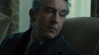 Movie still from “Philomena” (2013), directed by Stephen Frears – A person wearing a suit and tie; Close Up shot, Low angle