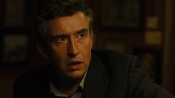 Movie still from “Philomena” (2013), directed by Stephen Frears – A person wearing a suit and tie; Close Up shot, Over the shoulder angle