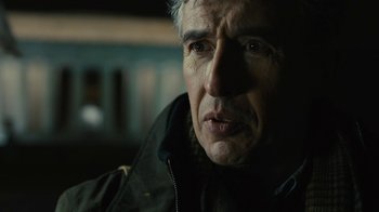 Movie still from “Philomena” (2013), directed by Stephen Frears – A person wearing a jacket; Close Up shot, Over the shoulder angle