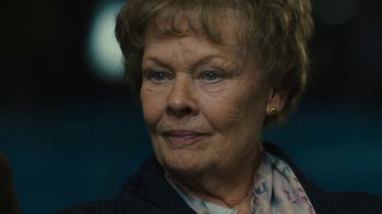 Movie still from “Philomena” (2013), directed by Stephen Frears – An older woman is looking into the distance; Close Up shot, Over the shoulder angle