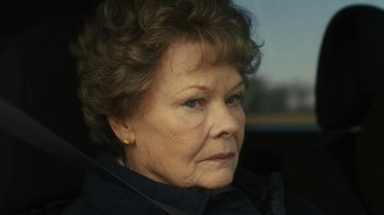 Movie still from “Philomena” (2013), directed by Stephen Frears – An older woman looking out the window of a car; Close Up shot, Over the shoulder angle