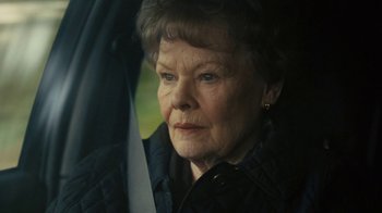 Movie still from “Philomena” (2013), directed by Stephen Frears – An older woman sitting in the back of a car; Close Up shot, Over the shoulder angle