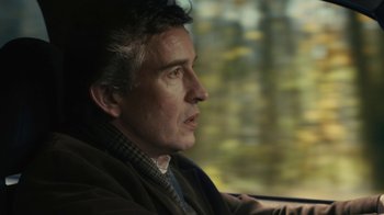 Movie still from “Philomena” (2013), directed by Stephen Frears – A person looking out a window; Close Up shot, Over the shoulder angle