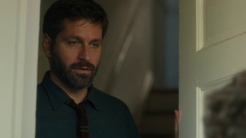 Movie still from “Philomena” (2013), directed by Stephen Frears – A man with a beard wearing a tie; Close Up shot, Over the shoulder angle