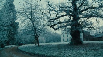 Movie still from “Philomena” (2013), directed by Stephen Frears – A tree in the middle of a snowy field; Extreme Wide shot, Low angle