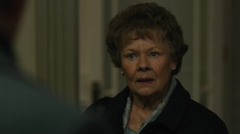 Movie still from “Philomena” (2013), directed by Stephen Frears – An older woman is looking at the camera; Close Up shot, Over the shoulder angle