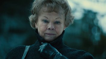 Movie still from “Philomena” (2013), directed by Stephen Frears – An older woman wearing a black jacket and black gloves; Close Up shot, Low angle