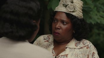 Movie still from “A League of Their Own” (2022), created by Abbi Jacobson – An older black woman wearing a hat talking to a younger black woman; Close Up shot, Over the shoulder angle