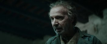 Movie still from “Pinocchio” (2019), directed by Matteo Garrone – An older man with a beard and a mustache; Close Up shot, Low angle