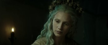 Movie still from “Pinocchio” (2019), directed by Matteo Garrone – A person with long green hair; Close Up shot, Over the shoulder angle