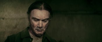 Movie still from “Pinocchio” (2019), directed by Matteo Garrone – A person wearing a black shirt; Close Up shot, Over the shoulder angle