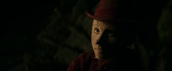 Movie still from “Pinocchio” (2019), directed by Matteo Garrone – A person wearing a hat; Close Up shot, High angle