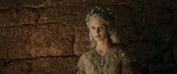 Movie still from “Pinocchio” (2019), directed by Matteo Garrone – A woman with white hair wearing a white dress; Close Up shot, High angle