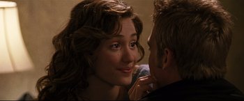 Movie still from “Poseidon” (2006), directed by Wolfgang Petersen – A man and a woman looking into each others eyes; Close Up shot, Over the shoulder angle