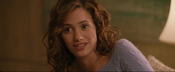 Movie still from “Poseidon” (2006), directed by Wolfgang Petersen – A person with curly hair; Close Up shot, Over the shoulder angle