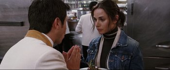 Movie still from “Poseidon” (2006), directed by Wolfgang Petersen – A man and a woman sitting at a table; Close Up shot, Over the shoulder angle