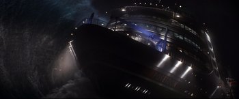 Movie still from “Poseidon” (2006), directed by Wolfgang Petersen – A ship in the water at night with a blue light; Extreme Wide shot, High angle