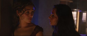 Movie still from “Poseidon” (2006), directed by Wolfgang Petersen – Two young women looking at each other in a dark room; Close Up shot, Over the shoulder angle