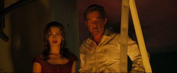 Movie still from “Poseidon” (2006), directed by Wolfgang Petersen – A man and a woman standing next to each other in a room; Medium shot, Low angle