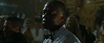 Movie still from “Poseidon” (2006), directed by Wolfgang Petersen – A person wearing a bow tie; Close Up shot, Low angle