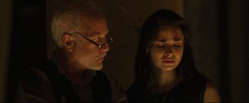 Movie still from “Poseidon” (2006), directed by Wolfgang Petersen – An older man and a young woman looking at each other; Close Up shot, Over the shoulder angle