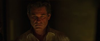 Movie still from “Poseidon” (2006), directed by Wolfgang Petersen – A person wearing a white shirt; Close Up shot, Low angle