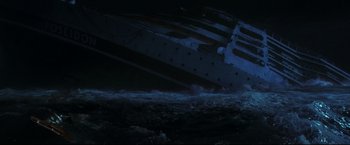 Movie still from “Poseidon” (2006), directed by Wolfgang Petersen – A boat is in the water at night time; Extreme Wide shot, High angle