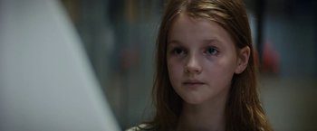 Movie still from “Prey for the Devil” (2022), directed by Daniel Stamm – A young girl looking at the camera; Close Up shot, Low angle