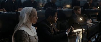 Movie still from “Prey for the Devil” (2022), directed by Daniel Stamm – A man and a woman sitting next to each other; Medium shot, High angle