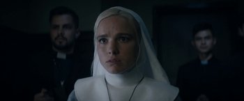 Movie still from “Prey for the Devil” (2022), directed by Daniel Stamm – A woman in a nun's outfit looking at the camera; Close Up shot, Low angle
