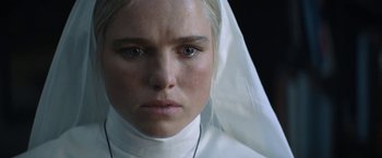 Movie still from “Prey for the Devil” (2022), directed by Daniel Stamm – A person wearing a nun's outfit; Close Up shot, Low angle