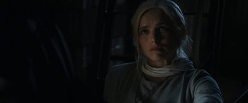 Movie still from “Prey for the Devil” (2022), directed by Daniel Stamm – A woman in a white shirt is looking at the camera; Close Up shot, Over the shoulder angle