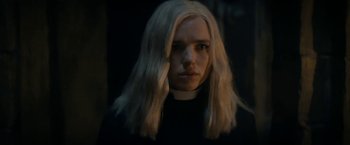 Movie still from “Prey for the Devil” (2022), directed by Daniel Stamm – A woman with long white hair wearing a black shirt; Close Up shot, Low angle