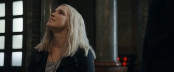 Movie still from “Prey for the Devil” (2022), directed by Daniel Stamm – A woman with long white hair looking up at the sky; Close Up shot, Low angle