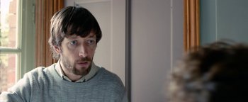 Movie still from “Pride” (2014), directed by Matthew Warchus – A man looking at himself in the mirror; Close Up shot, Over the shoulder angle