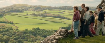 Movie still from “Pride” (2014), directed by Matthew Warchus – A woman standing on top of a hill looking out over a valley; Extreme Wide shot, High angle