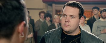Movie still from “Pride” (2014), directed by Matthew Warchus – A person wearing a leather jacket; Close Up shot, Over the shoulder angle