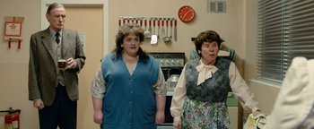 Movie still from “Pride” (2014), directed by Matthew Warchus – Two women standing next to each other in front of a stove; Medium shot, Over the shoulder angle