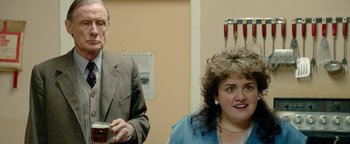 Movie still from “Pride” (2014), directed by Matthew Warchus – A man and a woman are standing in a room; Close Up shot, Over the shoulder angle