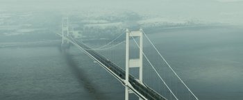 Movie still from “Pride” (2014), directed by Matthew Warchus – A large bridge with cars on it's side; Extreme Wide shot, High angle