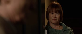 Movie still from “Pride” (2014), directed by Matthew Warchus – A person standing in a room; Close Up shot, Over the shoulder angle