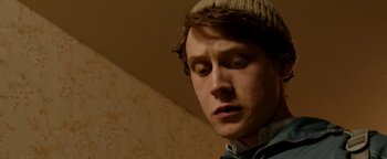 Movie still from “Pride” (2014), directed by Matthew Warchus – A young man with a woolen cap is looking down; Close Up shot, Low angle