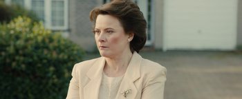 Movie still from “Pride” (2014), directed by Matthew Warchus – A person wearing a suit; Close Up shot, Over the shoulder angle