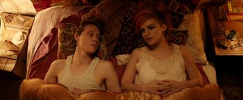 Movie still from “Pride” (2014), directed by Matthew Warchus – A man and a woman laying in bed under a blanket; Medium shot, Overhead angle