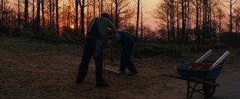 Movie still from “Prince Avalanche” (2013), directed by David Gordon Green – Two men are playing baseball in the woods at sunset; Wide shot, Low angle