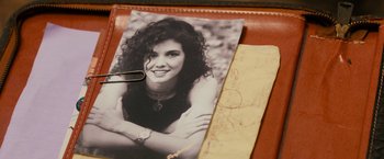 Movie still from “Prince Avalanche” (2013), directed by David Gordon Green – An old photo of a young woman with curly hair; Extreme Close Up shot, Overhead angle